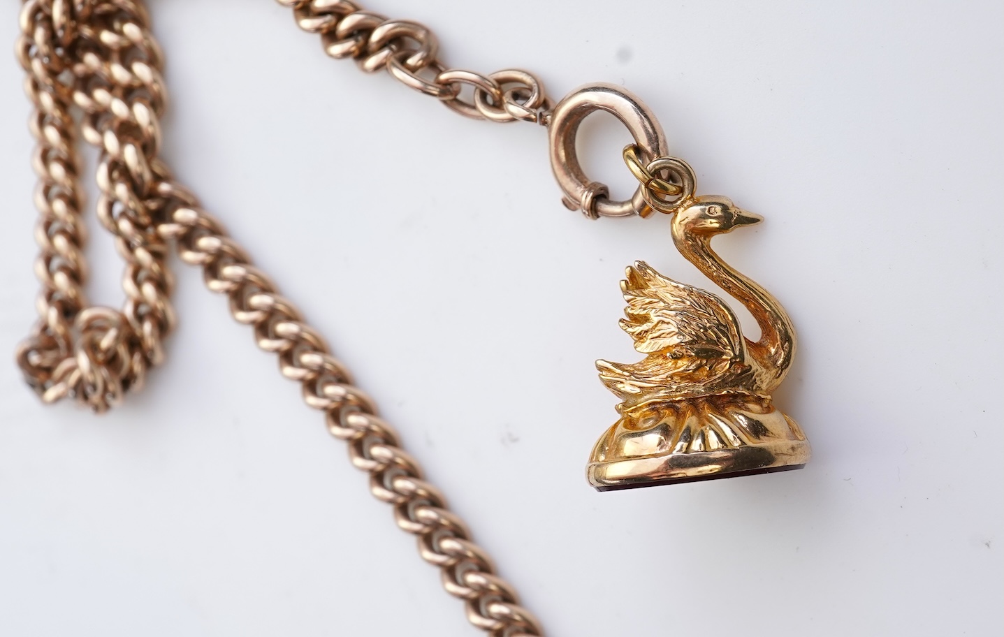 A gold Albert chain, sovereign coin pendant and fob seal, early 20th century
